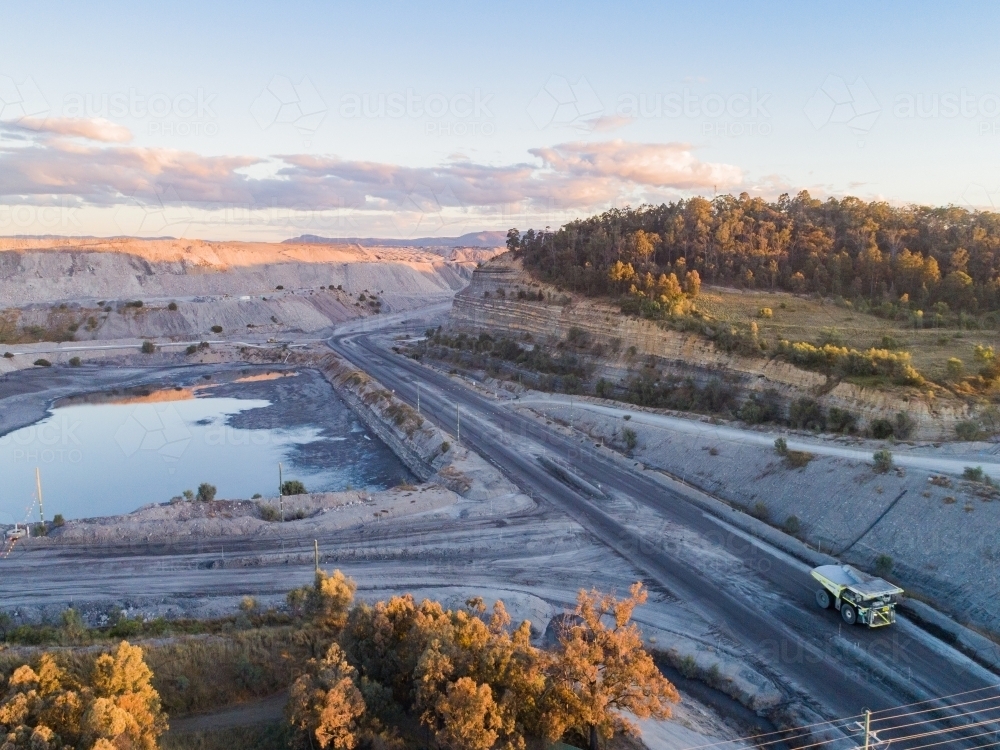 Aerial view of open cut coal mine with water near Singleton - Australian Stock Image