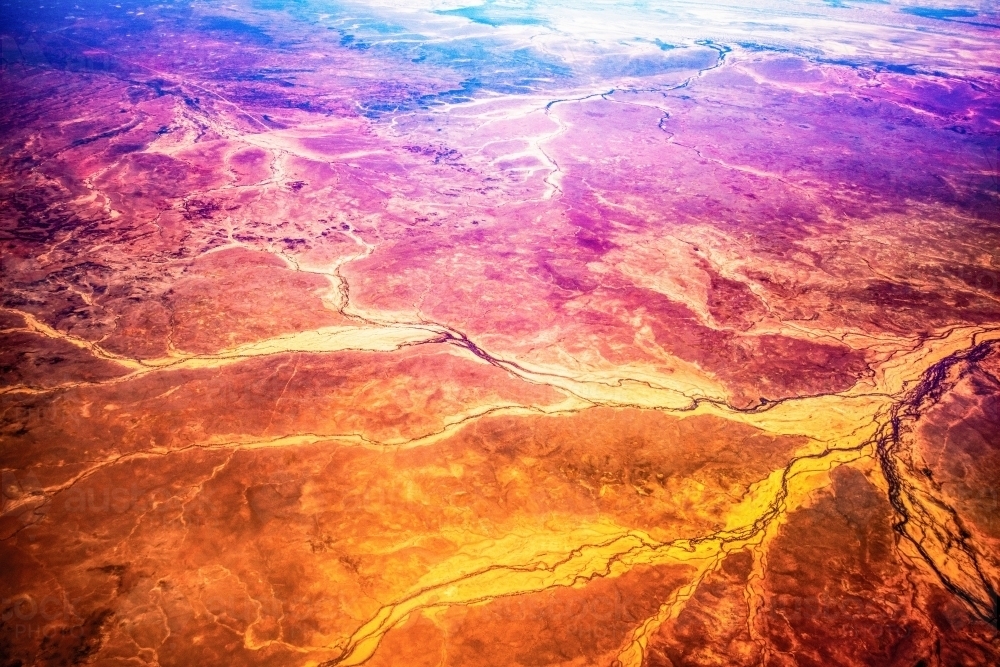 Aerial view of outback Australia with red land and dried creeks from an artistic perspective. - Australian Stock Image