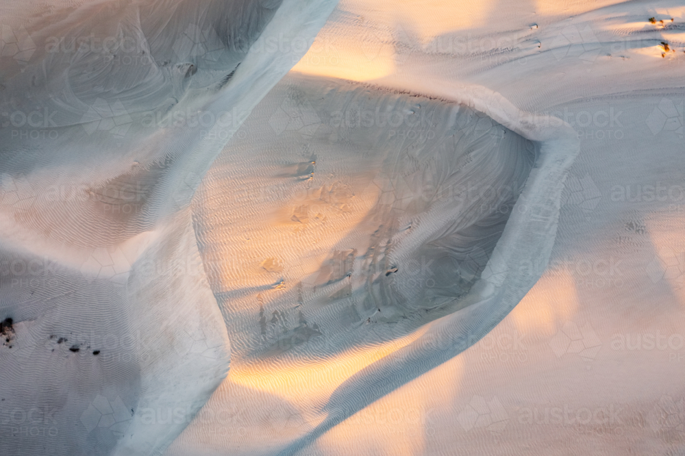 Aerial view of patterns and drift deatils of white sand dunes - Australian Stock Image