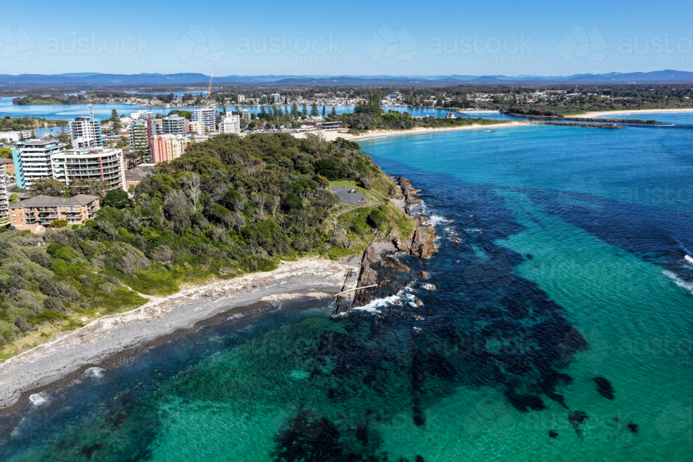 Aerial view of Pebbly Beach in Forster, showcasing its unique rocky shoreline - Australian Stock Image