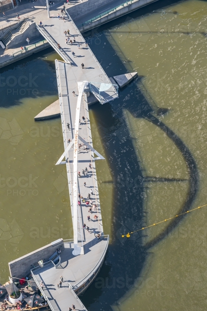 Aerial view of people crossing the Evan Walker bridge crossing the Yarra River - Australian Stock Image