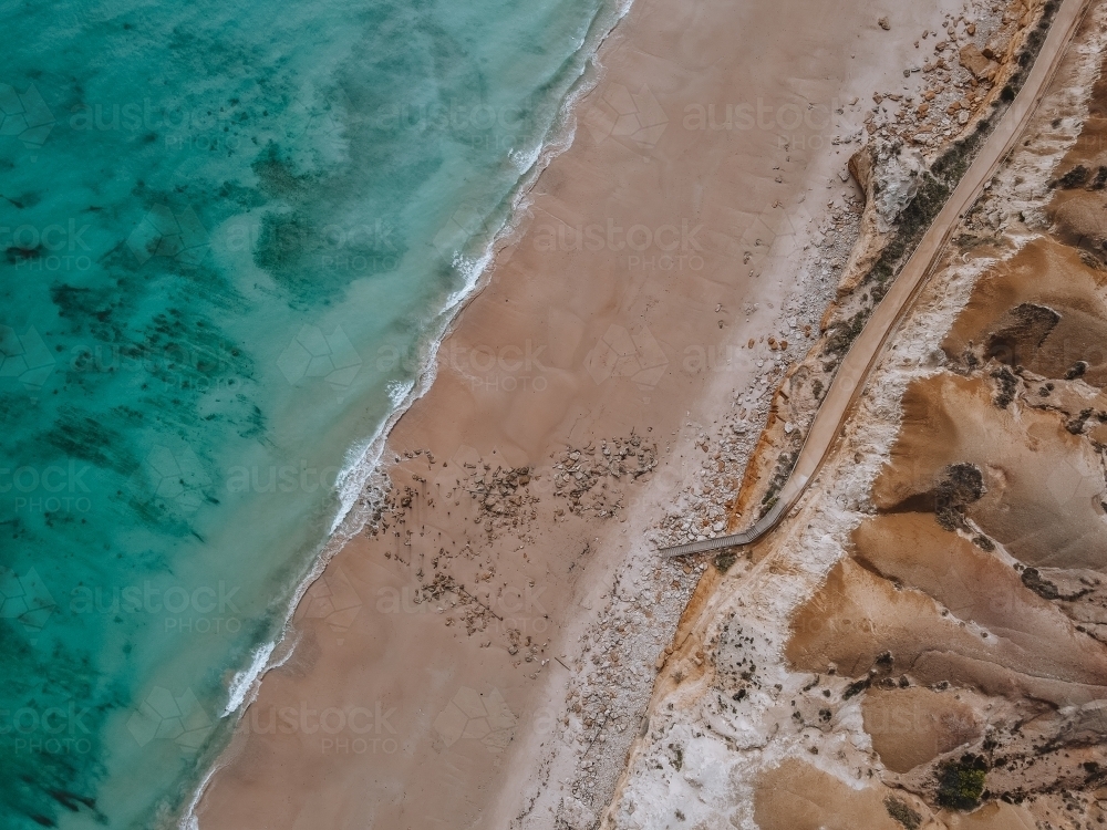 Aerial view of Port Willunga Beach - Old Jetty and walkway and stairs to beach from above - Australian Stock Image