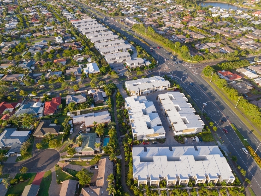 Aerial view of residential developments alongside a major road - Australian Stock Image