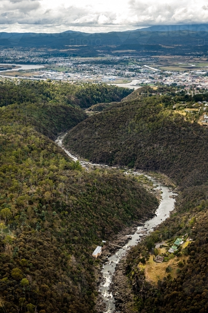 Aerial view of river running through bushland - Australian Stock Image