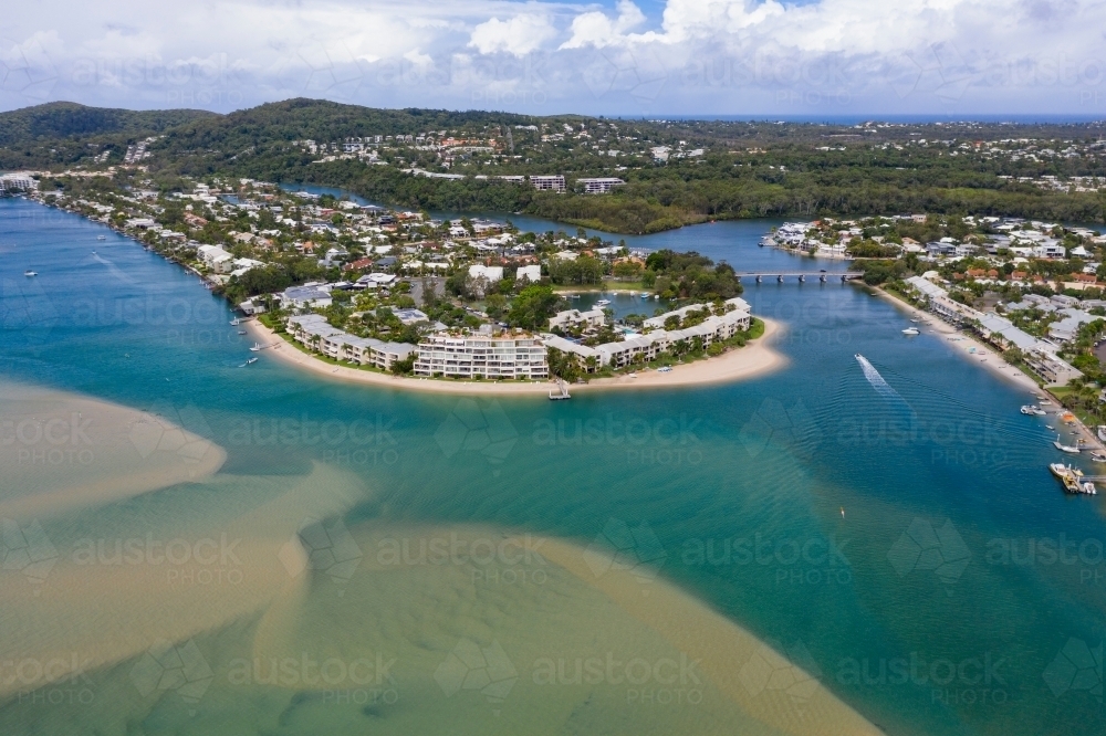 Image of Aerial view of river front real estate and canals of a coastal