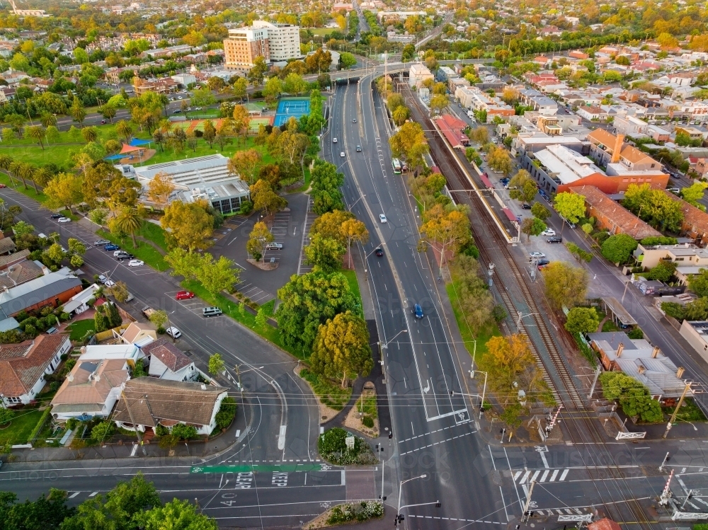 Suburb Intersection Image of Aerial view of roads, intersections and railway lines through ...