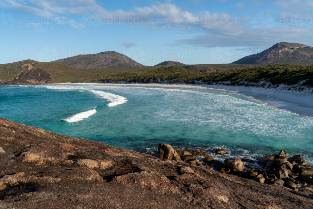 Aerial view of rocky terrain on the coast with turquoise water - Australian Stock Image