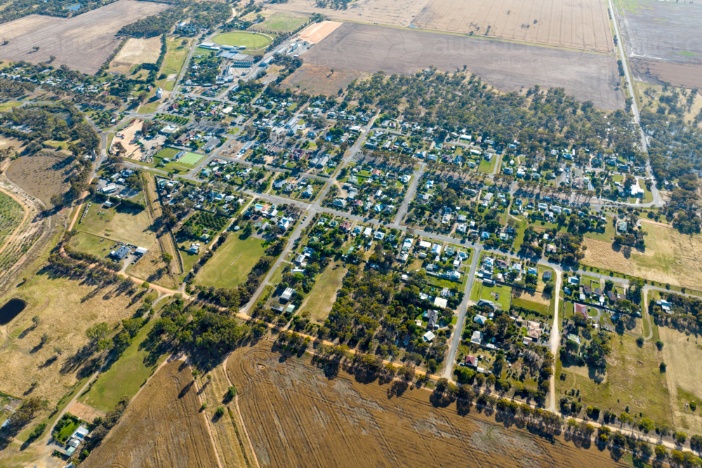 Aerial view of Rupanyup township surrounded by dry farmland and open plains. - Australian Stock Image