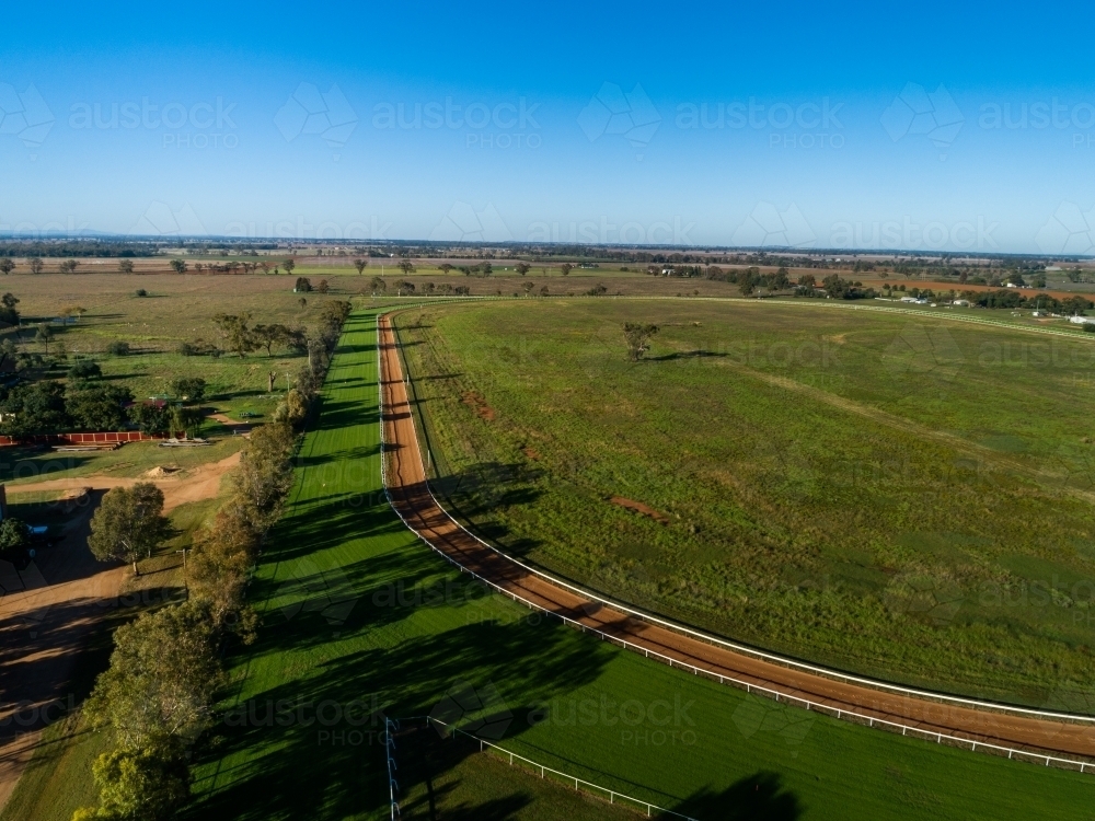 Aerial view of rural racetrack for racehorses empty in early morning light - Australian Stock Image