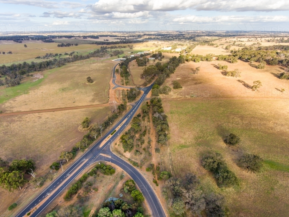 Arial View Rural Intersection Image of aerial view of rural road with altered layout - Austockphoto