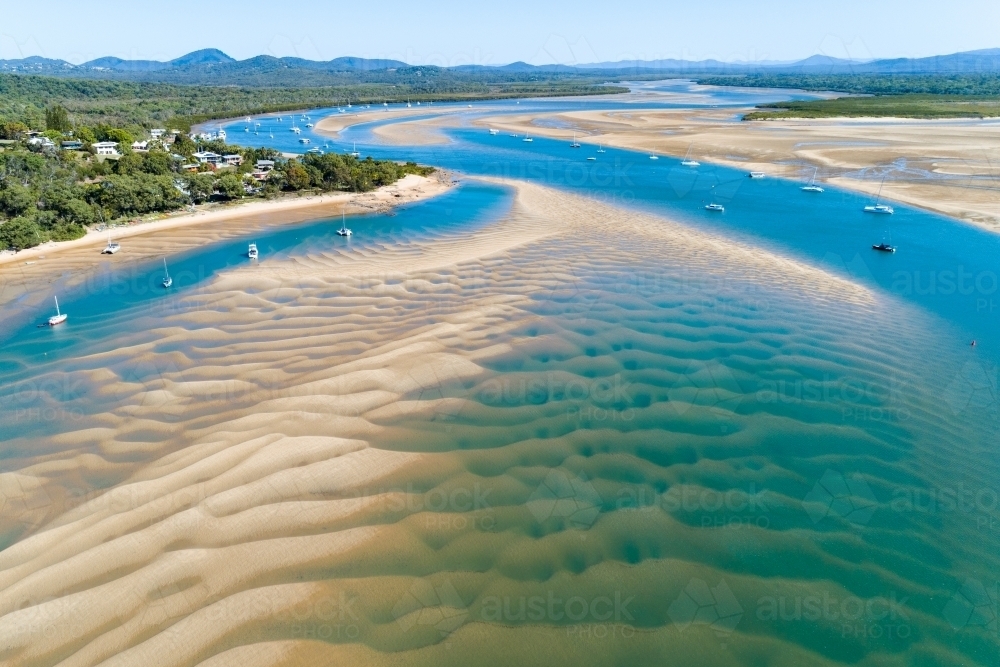 Aerial view of sandbars and yachts anchored in the estuary, Town of 1770, QLD. - Australian Stock Image