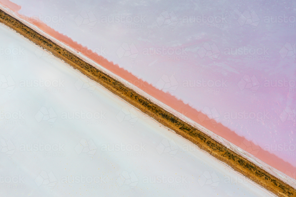 Aerial view of sections of levee banks on a salt lake - Australian Stock Image