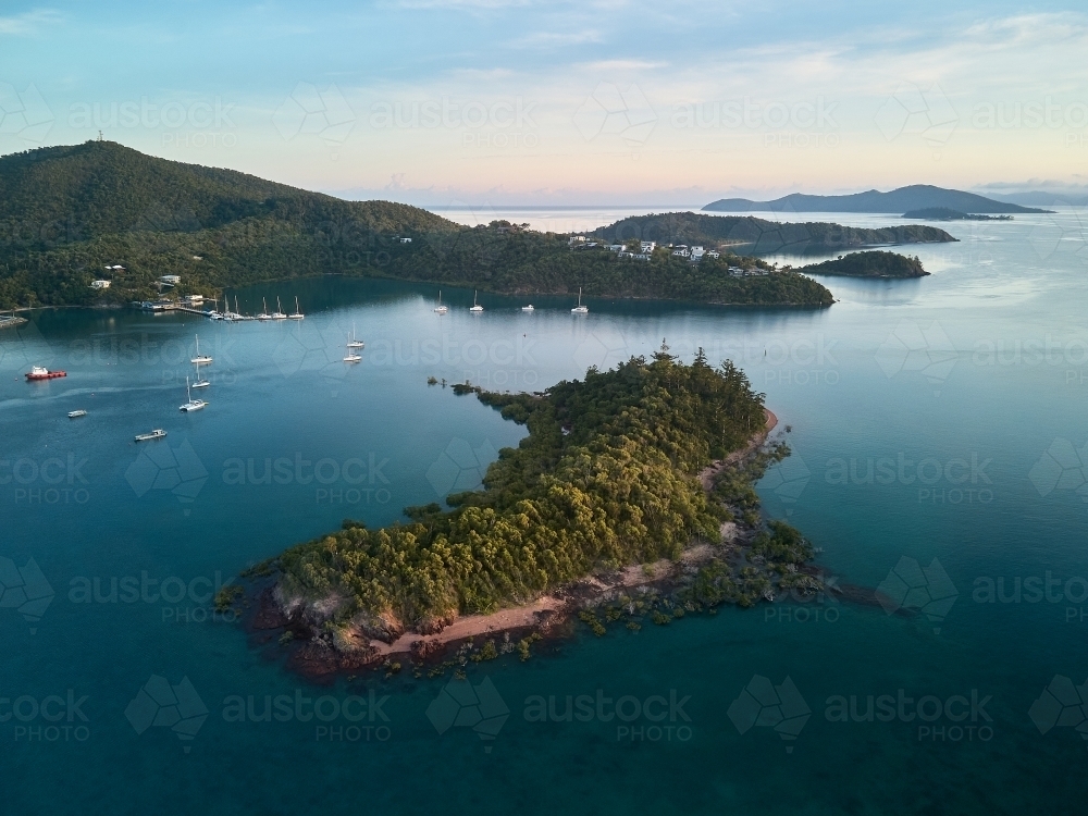 Aerial view of Shute Harbour looking North towards islands and the sea - Australian Stock Image