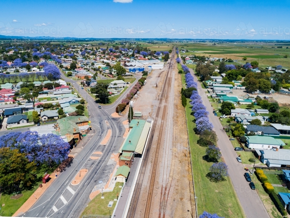 aerial view of singleton train station with empty carparking facilities and railway track - Australian Stock Image