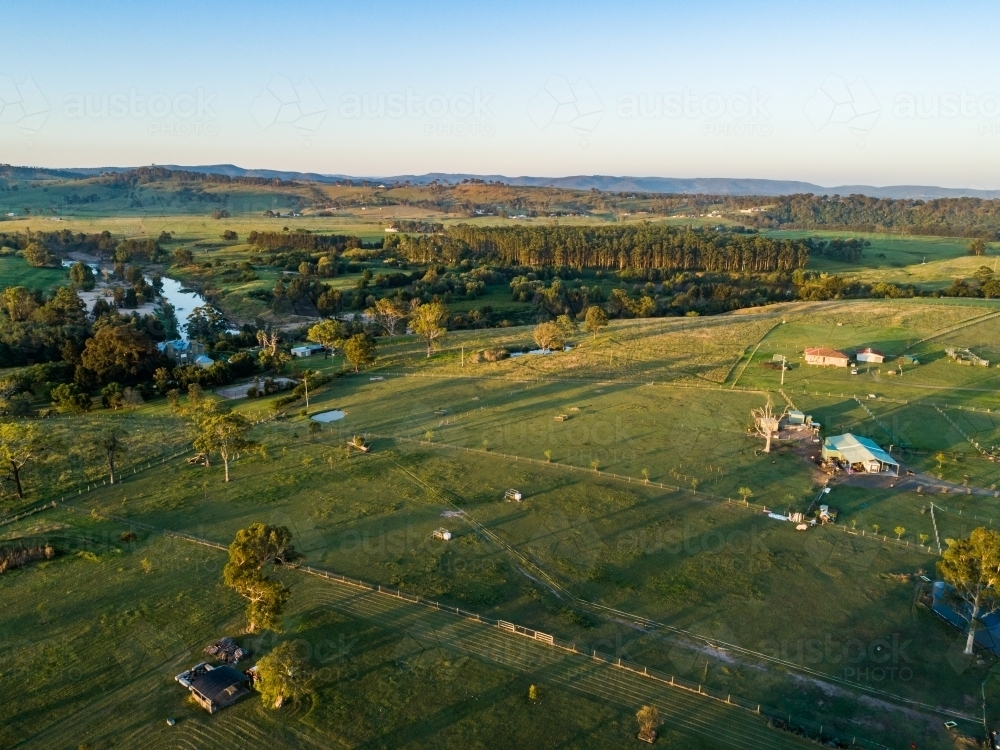 Aerial view of small acreage properties backing onto farmland at edge of town in Hunter Valley - Australian Stock Image