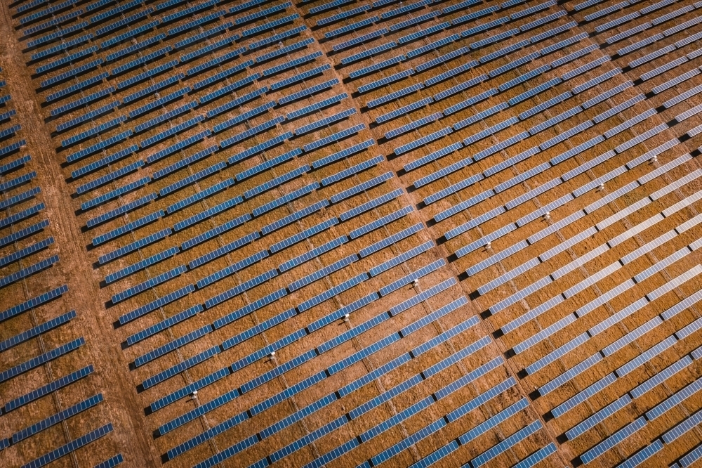 Aerial view of solar farm panels for renewable energy. - Australian Stock Image