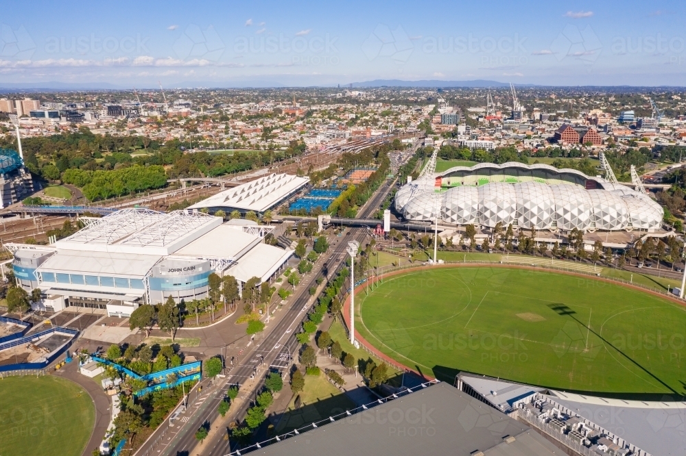 Aerial view of sports grounds and arenas along a city highway - Australian Stock Image