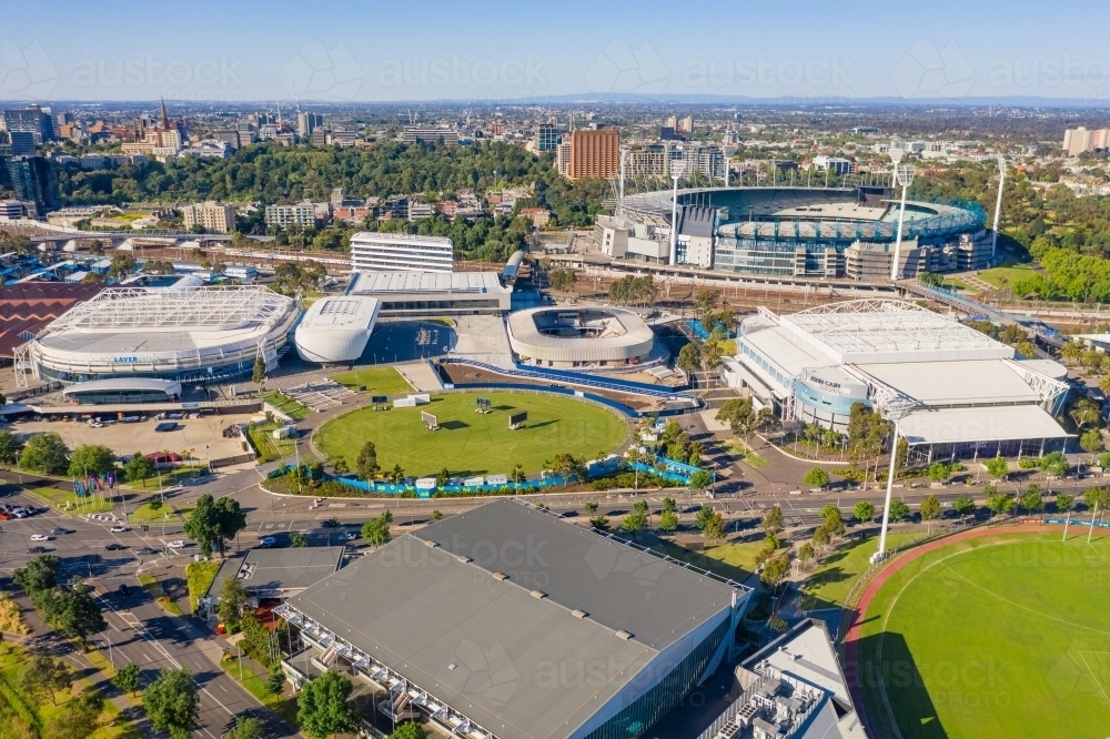 Aerial view of sports grounds and arenas along a city highway - Australian Stock Image