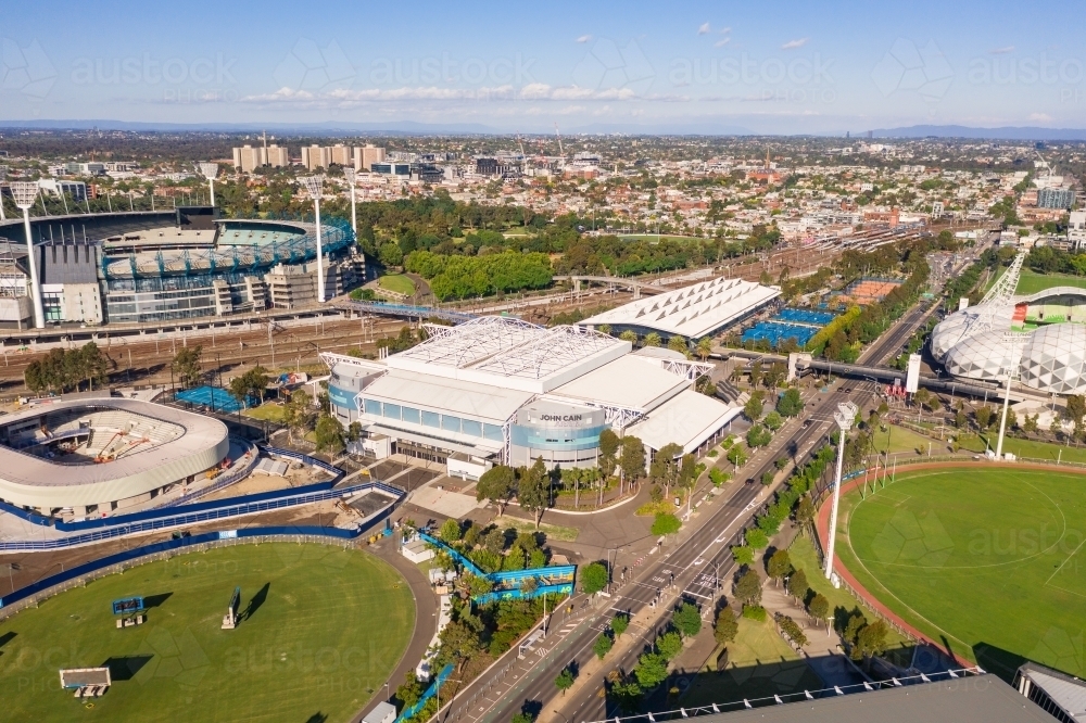 Aerial view of sports grounds and arenas along a city highway - Australian Stock Image