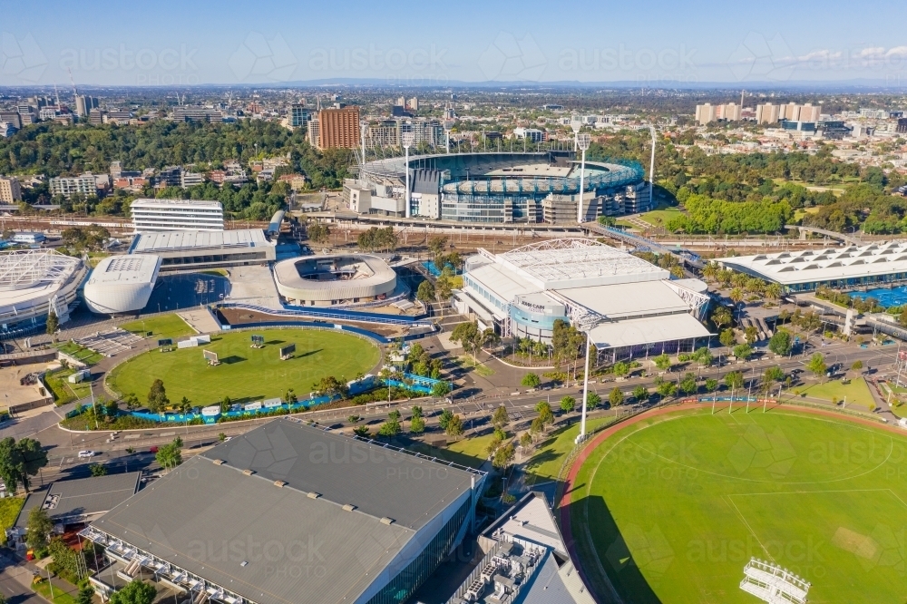Aerial view of sports grounds and arenas along a city highway - Australian Stock Image