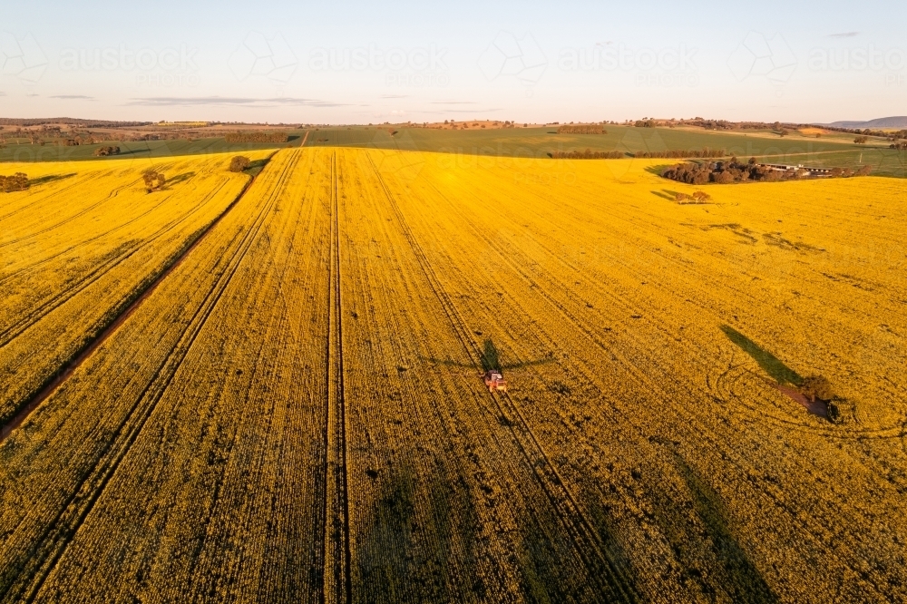 Aerial view of spraying on farm - Australian Stock Image