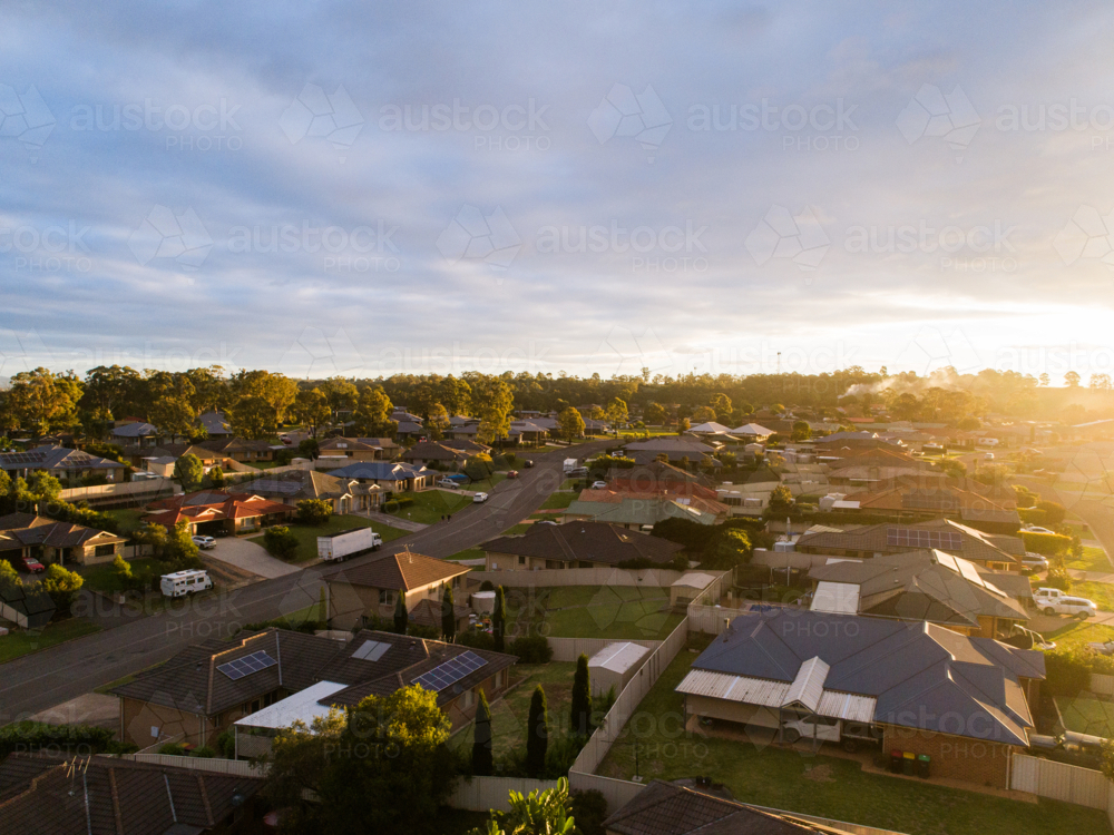 Aerial view of sunset light over homes in housing suburb of Singleton Heights in the Hunter Valley - Australian Stock Image