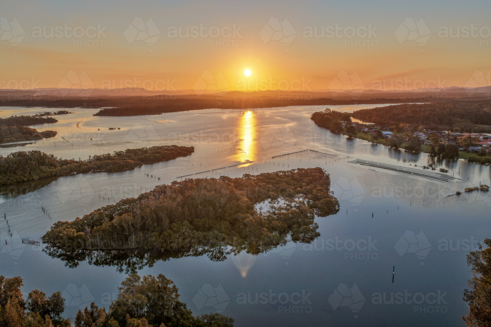 aerial view of sunset over the river and small islands at Tuncurry - Australian Stock Image