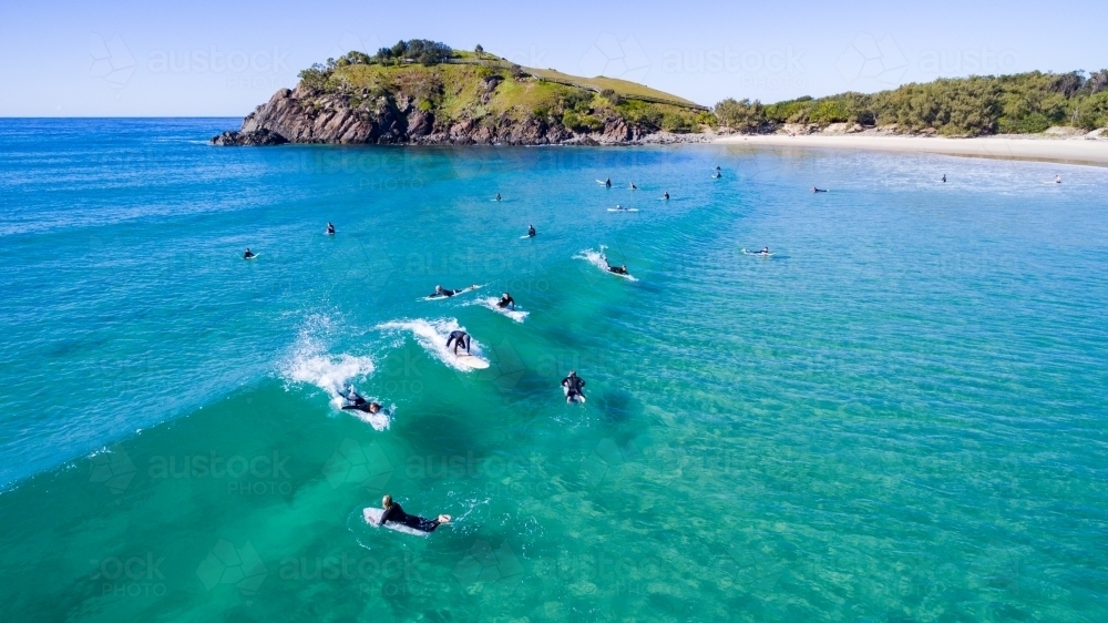 Aerial view of surf and surfers at Cabarita Beach. - Australian Stock Image
