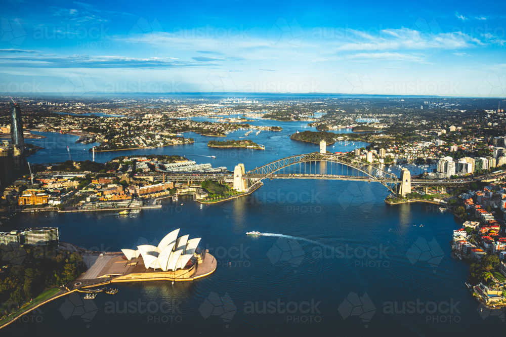 Aerial view of Sydney Harbour showcasing the Sydney Opera House and the Sydney Harbour Bridge - Australian Stock Image