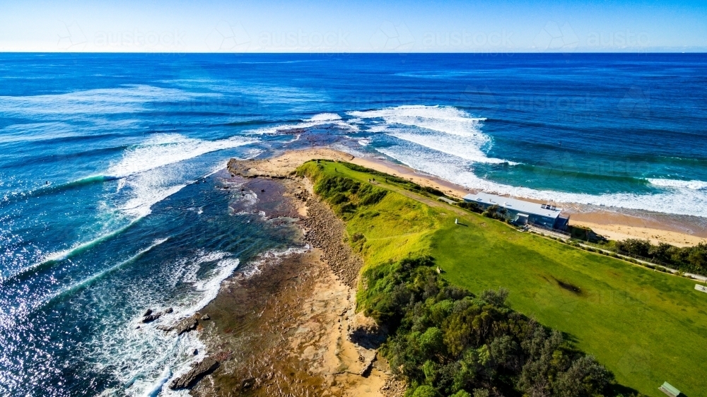 Aerial view of the famous surfing headland Sandon Point, Bulli, NSW - Australian Stock Image