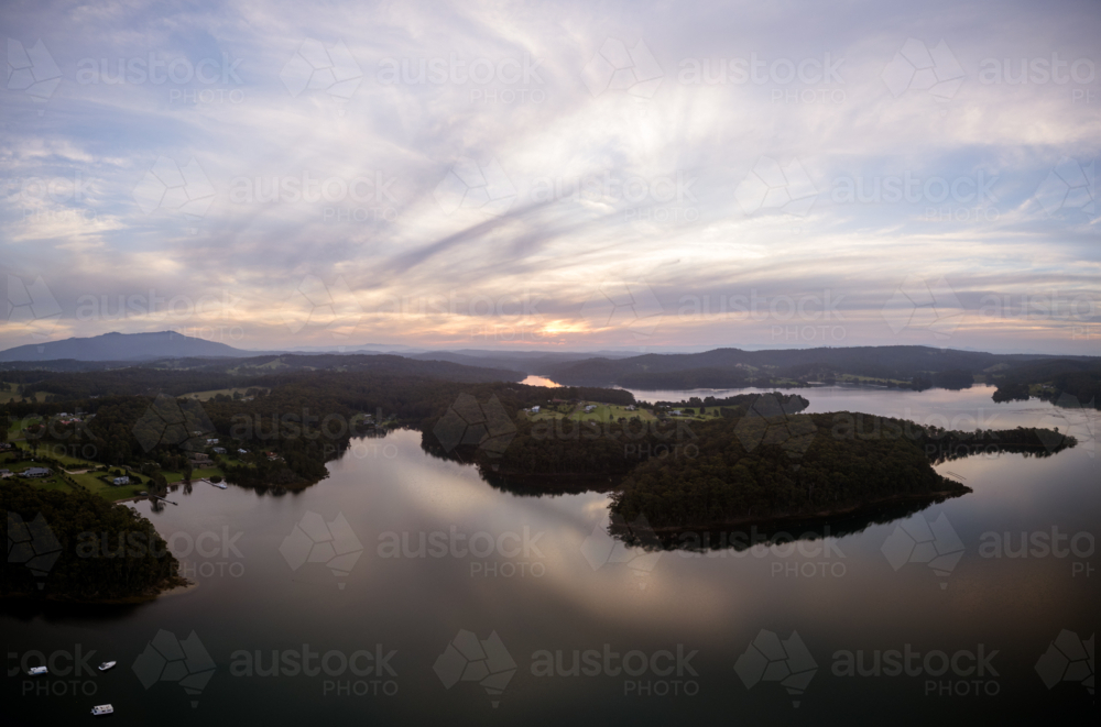 Image of Aerial view of the idyllic coastal town of Narooma at sunset ...