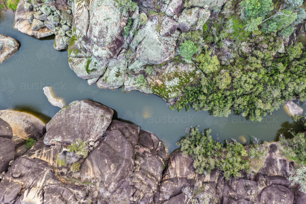 Aerial view of the natural rock pool and striking granite rock formations at Cranky Rock Reserve - Australian Stock Image