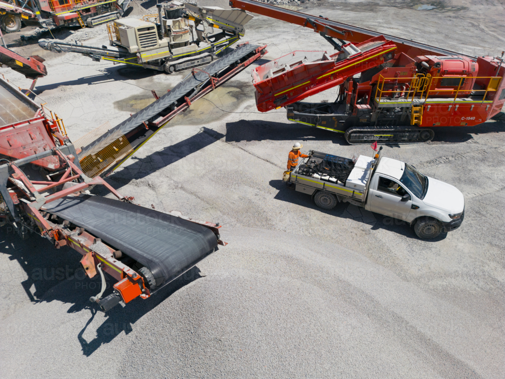 Aerial view of the quarry with machineries. - Australian Stock Image