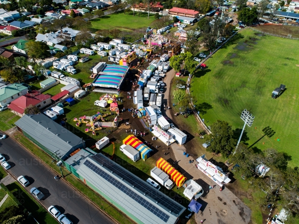 Aerial view of the showring and sideshow alley at agricultural show fairground - Australian Stock Image