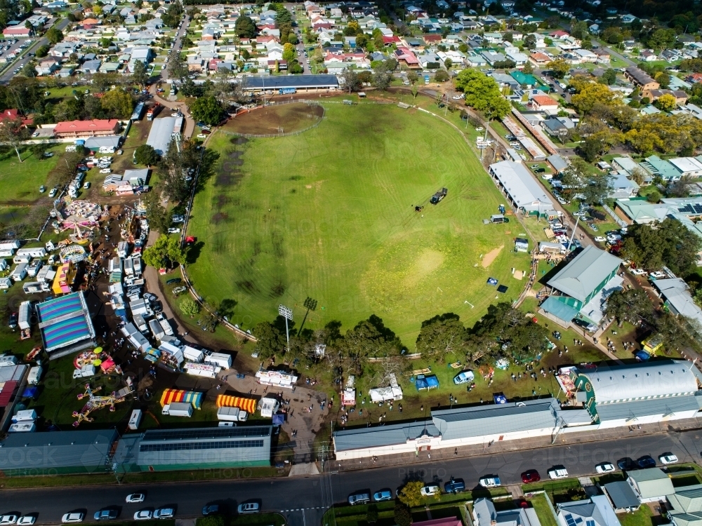 Aerial view of the showring and sideshow alley at agricultural show fairground while the show is on - Australian Stock Image