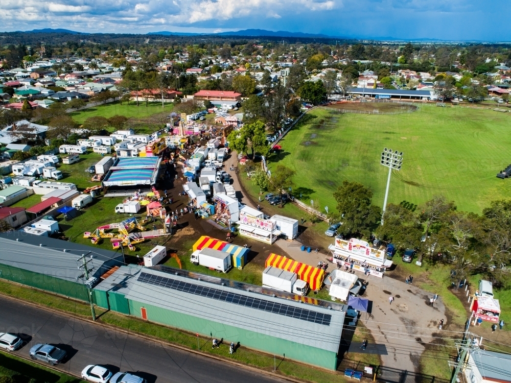 Aerial view of the showring, pavilions and sideshow alley at agricultural show fairground - Australian Stock Image