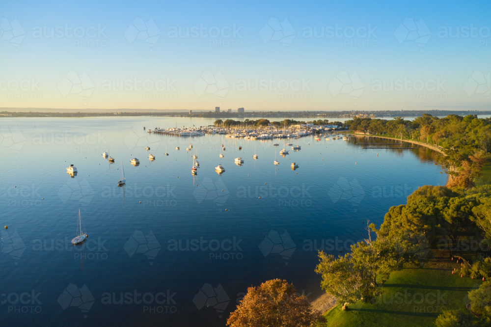 Aerial view of the Swan River in Perth with yachts and boats on the still water - Australian Stock Image