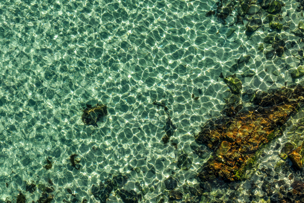 Aerial view of The Tanks in Forster, showcasing the iconic rock formations and clear waters - Australian Stock Image
