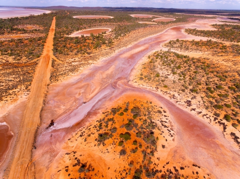 Aerial view of track through salt flats - Australian Stock Image