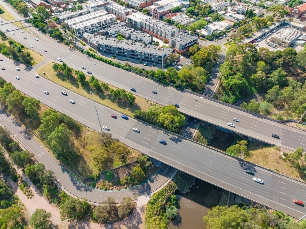 Aerial view of traffic on a multi-lane freeway bridge over a river - Australian Stock Image