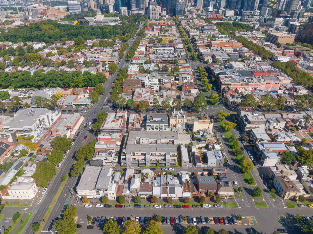 Aerial view of treelined inner city blocks of low rise buildings - Australian Stock Image