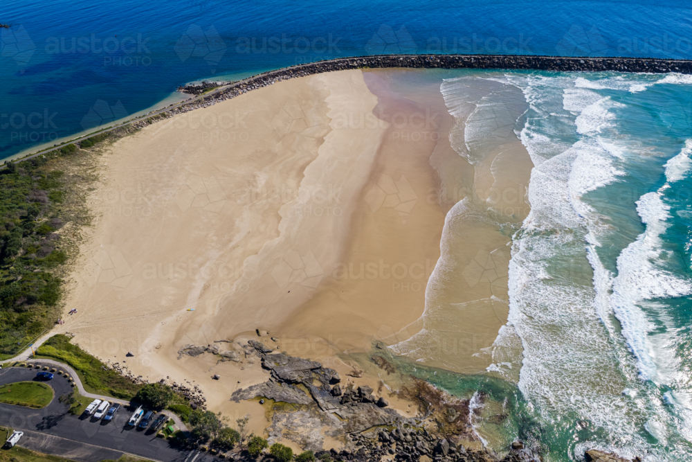 Aerial view of Turners Beach and the southern breakwall at Yamba, showing the sandy shoreline - Australian Stock Image