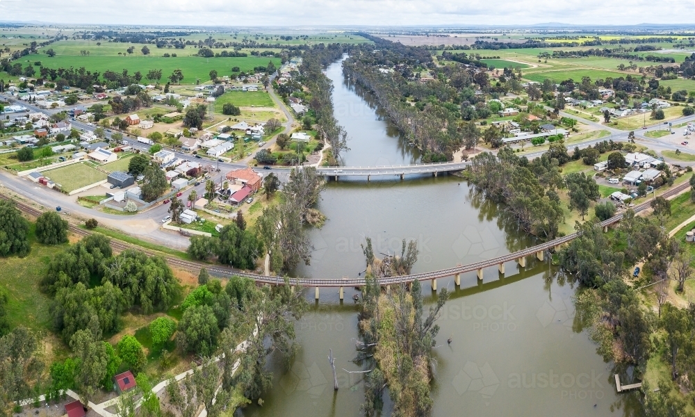 Image of Aerial view of two bridges crossing a tree lined river ...