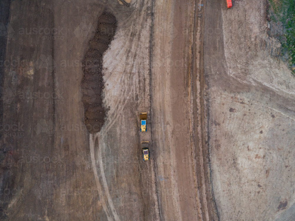 Aerial view of two heavy machinery vehicles for earthworks on construction site for Singleton Bypass - Australian Stock Image