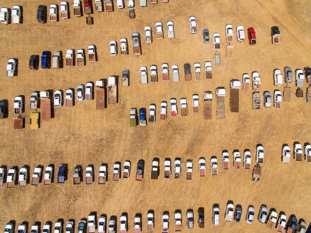 aerial view of vehicles including trucks and utes parked in rural area - Australian Stock Image