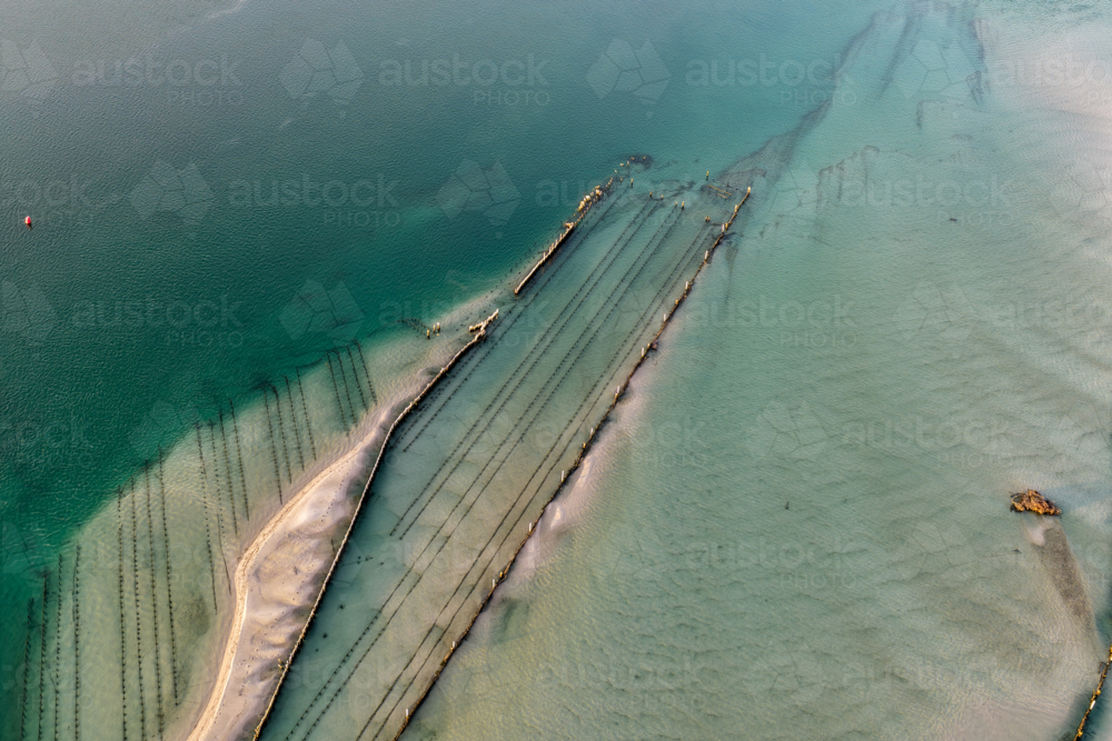 Aerial view of Wallis Lake at low tide, revealing intricate sand patterns - Australian Stock Image