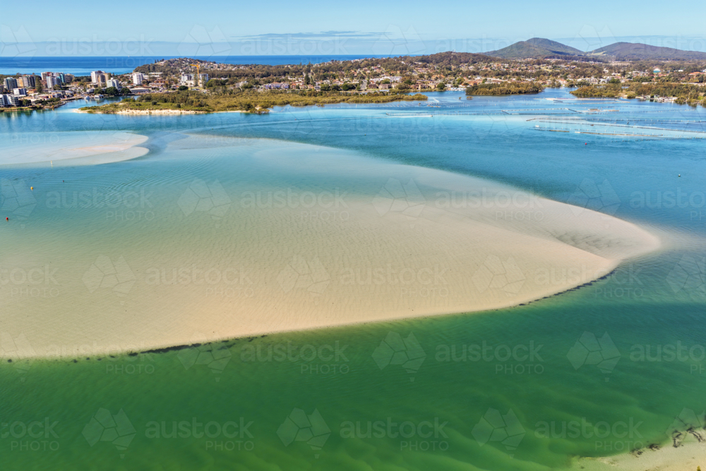 Aerial view of Wallis Lake at low tide, revealing intricate sand patterns - Australian Stock Image