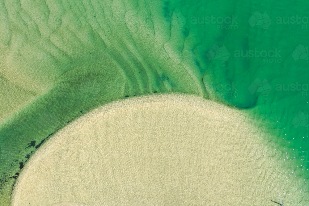 Aerial view of Wallis Lake at low tide, revealing intricate sand patterns - Australian Stock Image