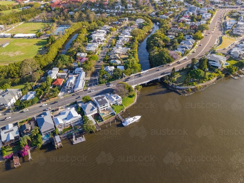 Image of Aerial view of waterfront real estate on a river bank