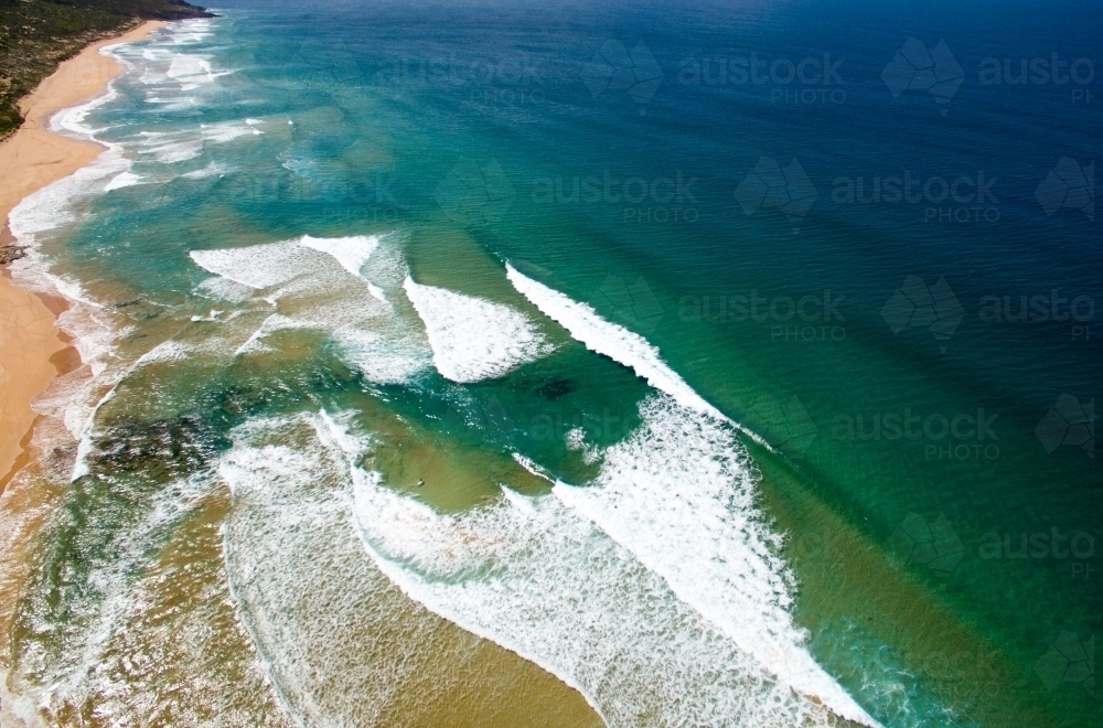 aerial view of waves coming into shore - Australian Stock Image